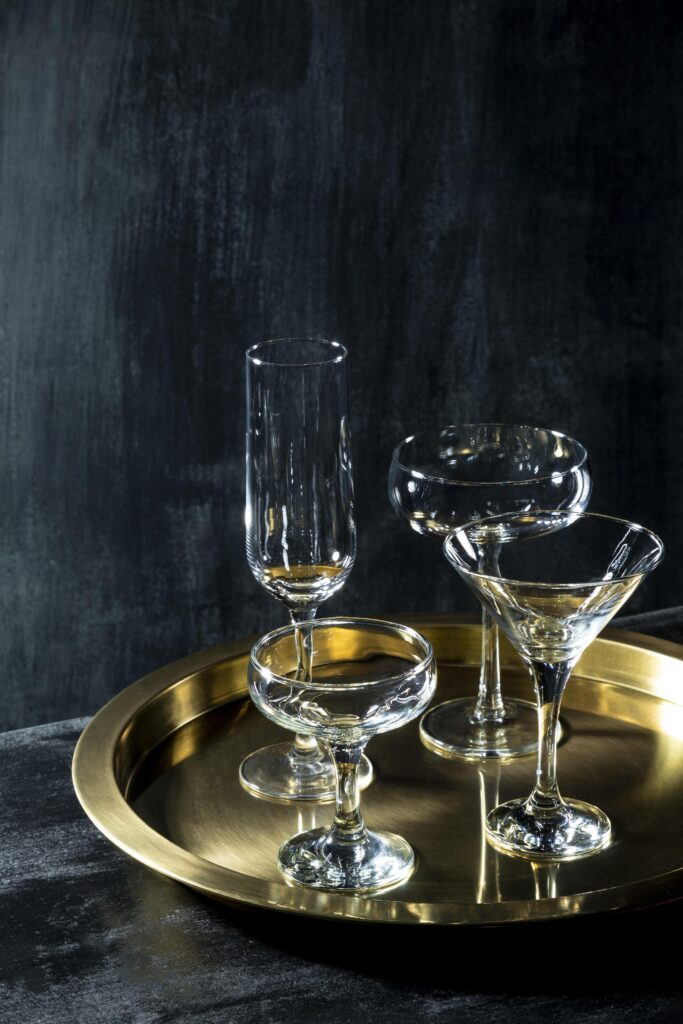 Elegant glassware set on a gold tray